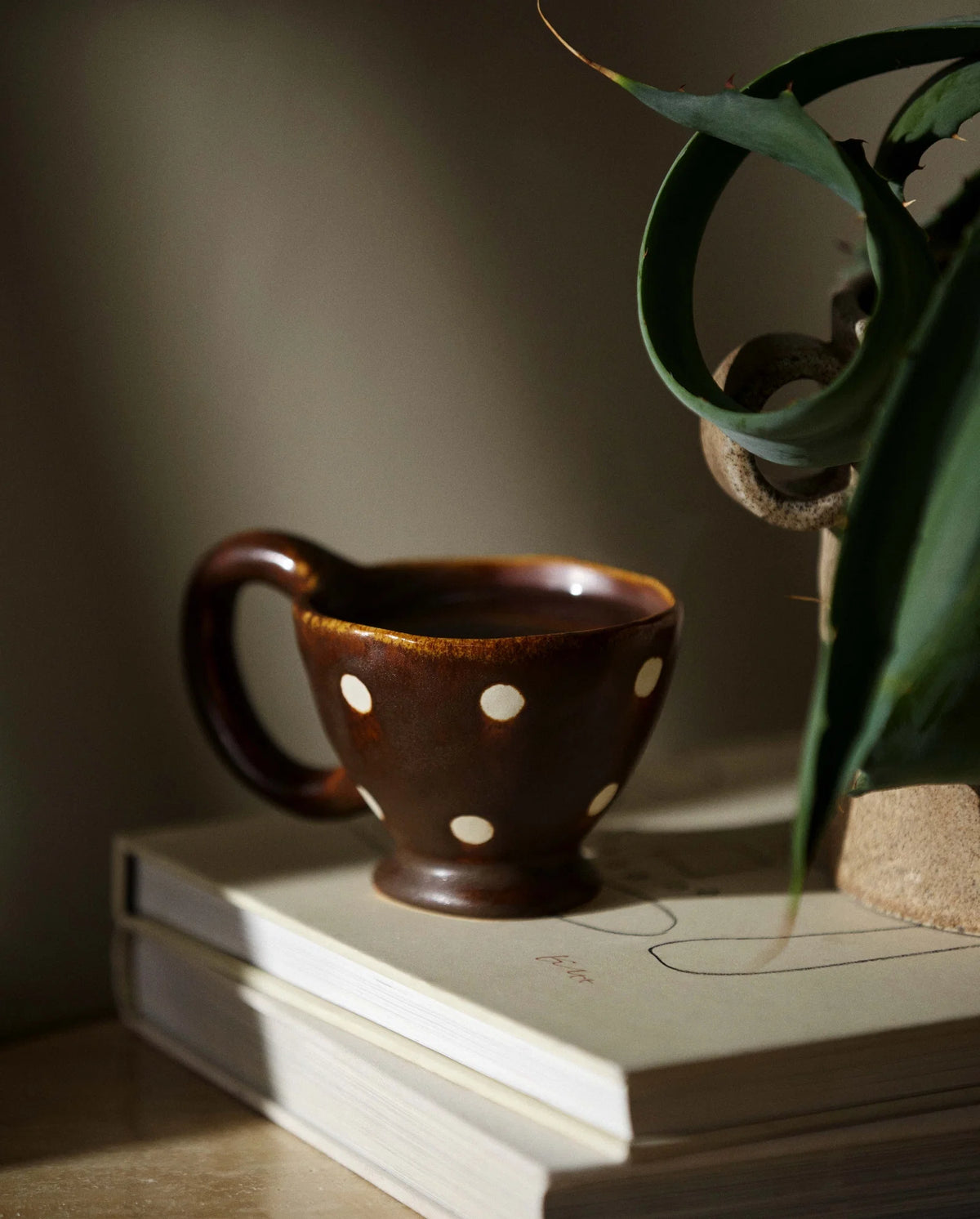 ZINA cup by Nordal in deep brown with cream hand-painted dots, plain product shot