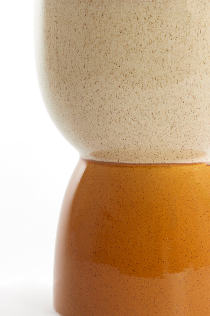 detail of finca side table showing transition from cream glaze to ochre ceramic base