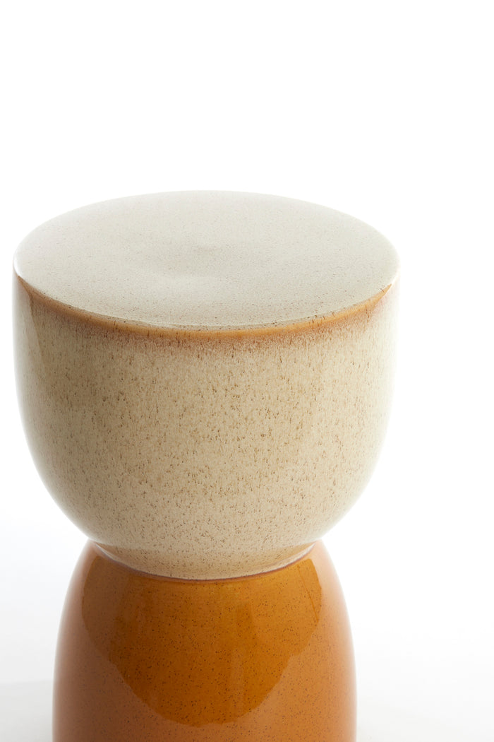 finca side table in cream and ochre ceramic with rounded pedestal shape
