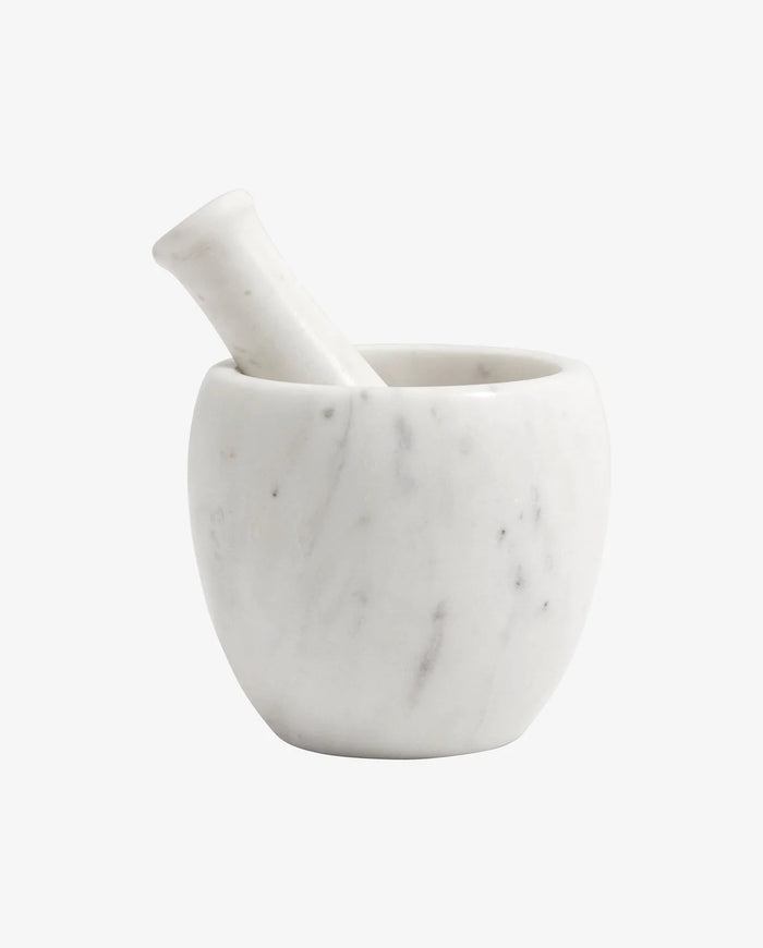 White marble mortar with brass pestle