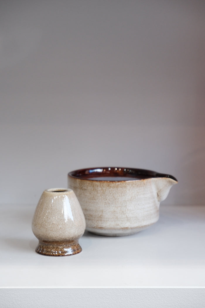 side view of 80s style matcha bowl set showing brown interior glaze and pouring spout
