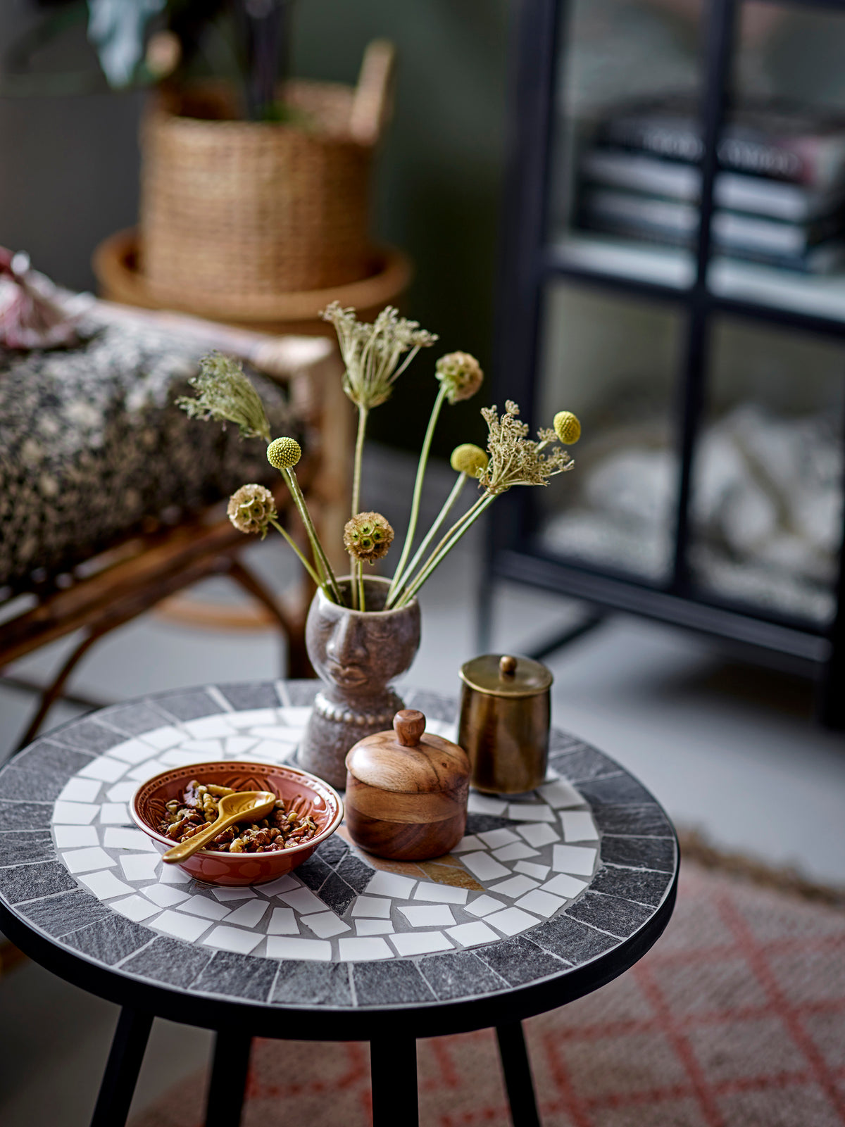 Rani stoneware spoons in yellow and grey displayed on a mosaic table with matching ceramics