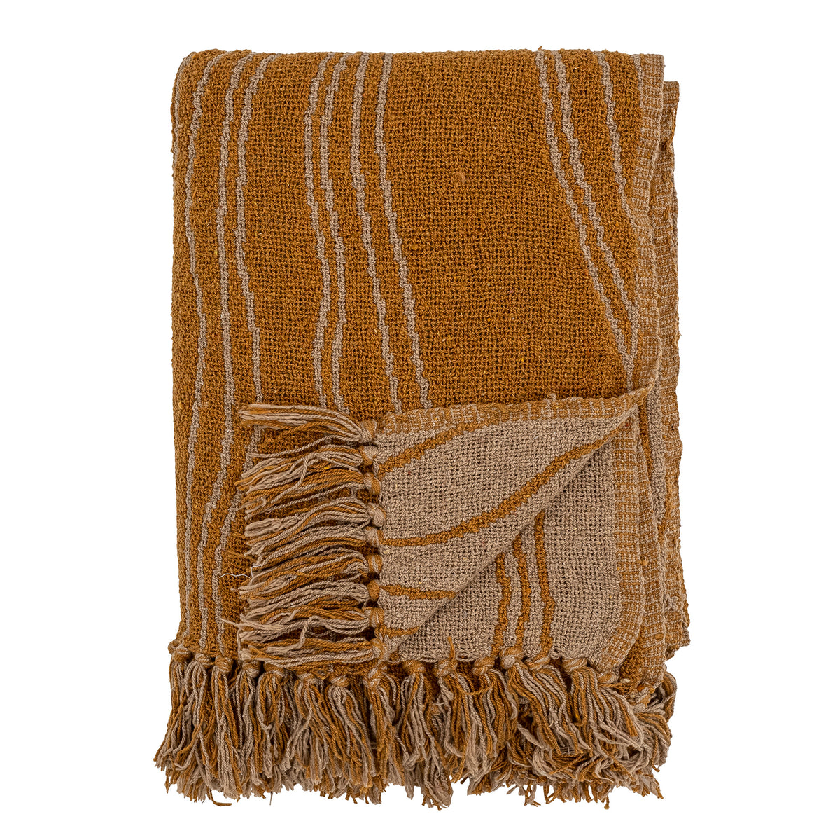 folded ginna throw in brown showing fringes and reversible wavy pattern
