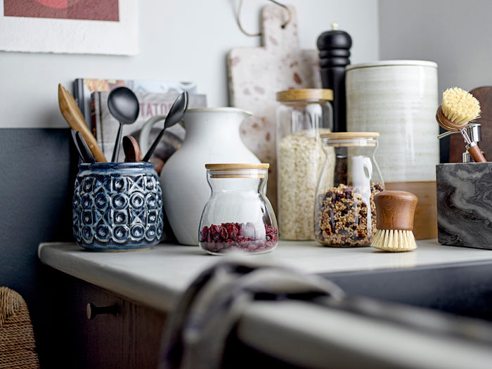 Nukaka marble board styled in a Nordic kitchen with utensils and jars
