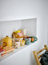 Bloomingville MINI Addy cups and matching kids tableware in a playful display
