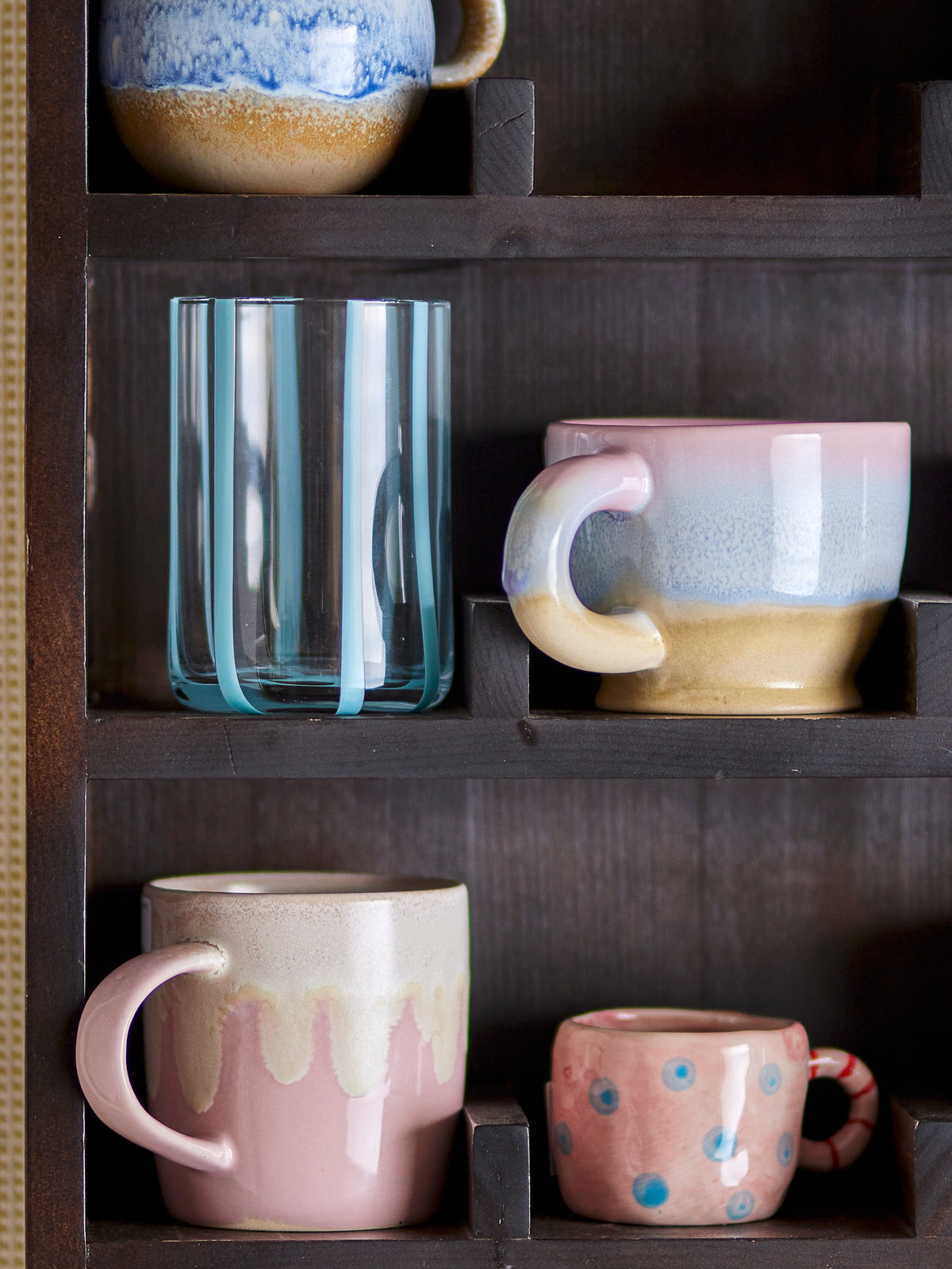 Louisa cup in rose pink stoneware, showing unique running glaze
