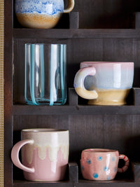 Louisa cup in rose pink stoneware, showing unique running glaze
