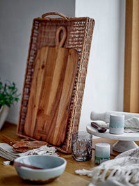 green and white stoneware salt and pepper shakers on rustic kitchen counter
