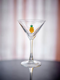 Misa cocktail glass with yellow pineapple decoration, close-up on a table with soft background, 170ml
