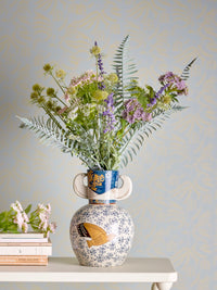 Hezha navy blue vase front view showing golden bird illustration and floral pattern