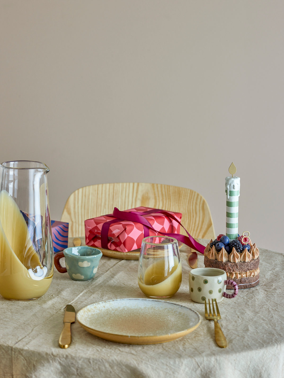 playful stoneware nini cups by bloomingville styled on a cosy breakfast table