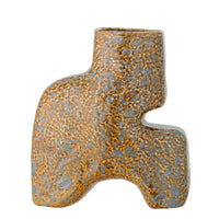 Ollia vase used as a bookend with other decorative ceramics
