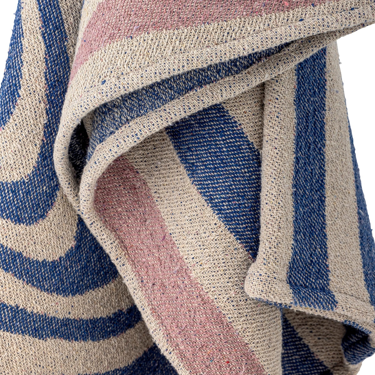 Close up of Arlie throw fabric showing reversed colourway on the back