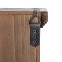 Close-up of a top corner of the Hazem cabinet, showing the hanging bracket and worn black lacquer finish