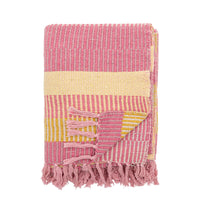 folded Isnel throw in pink and yellow stripes with fringed ends