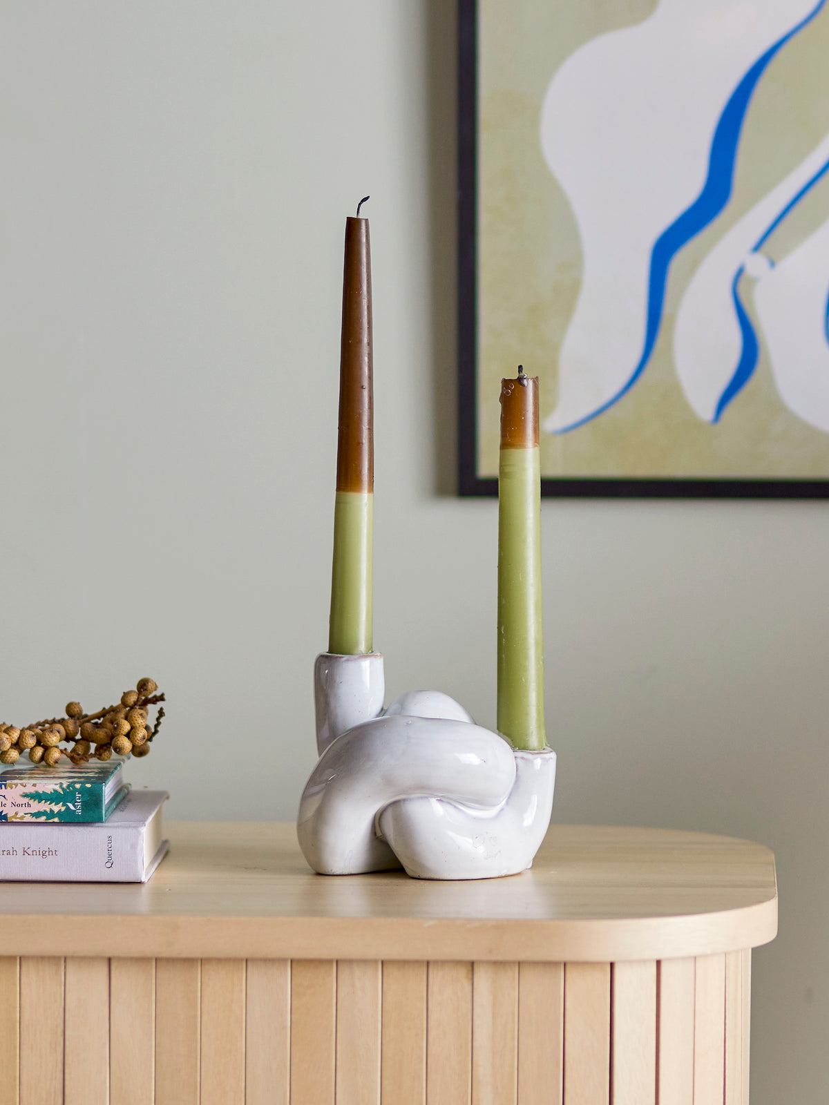 green and brown dip dye bloom­ingville burma candles styled in a white sculptural candle holder
