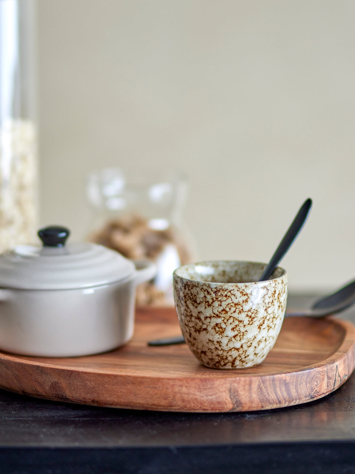Paula brown stoneware cup styled on a wooden breakfast tray
