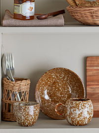 Paula brown reactive glaze cup stacked with matching stoneware bowl
