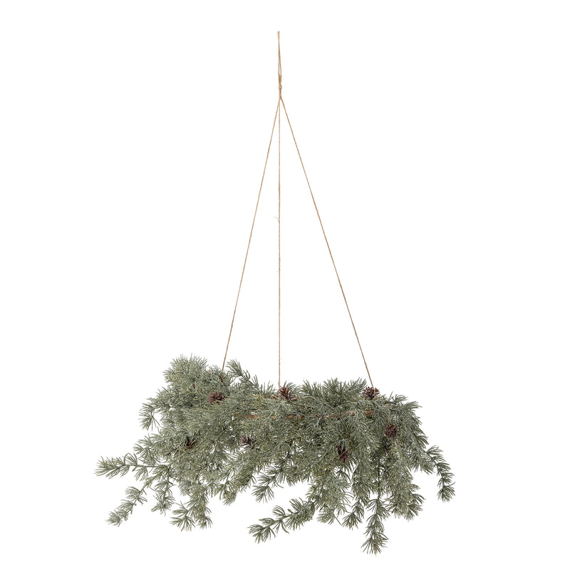Cedar wreath hanging horizontally from three jute cords, with frosted green branches and pine cones, on a white background