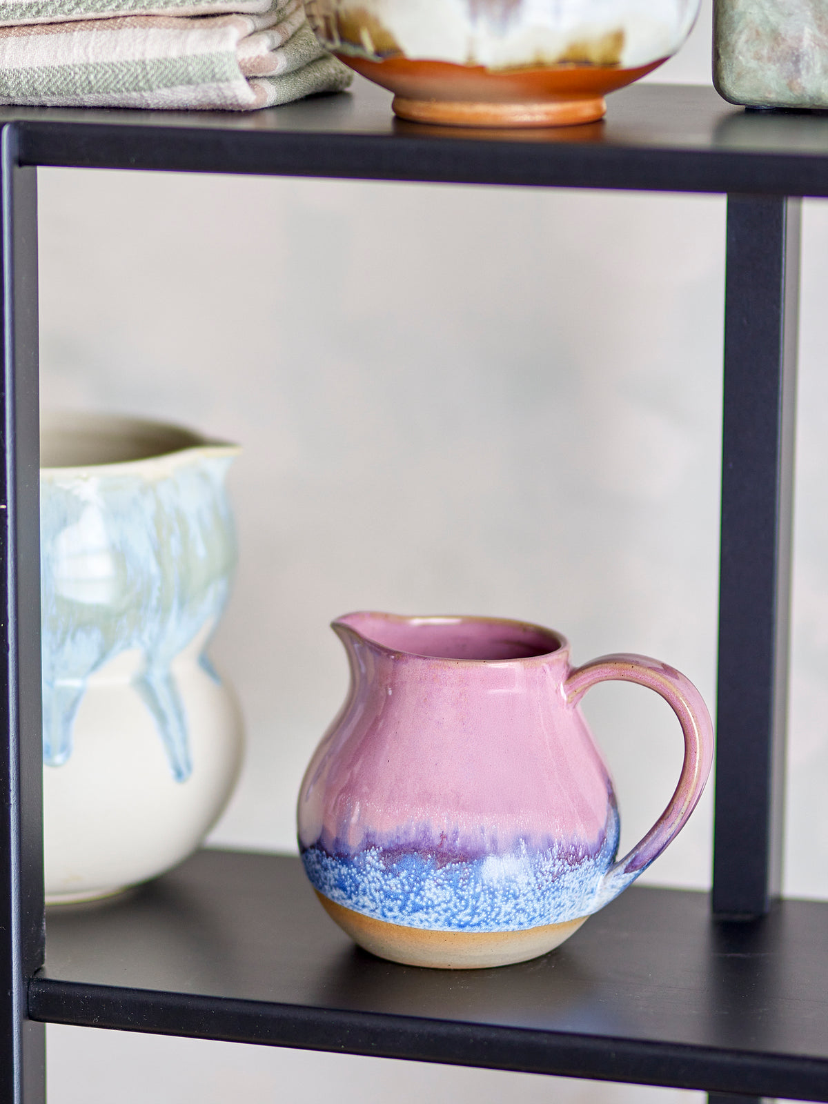 pink and blue bloomingville paula milk jug styled on a shelf with other ceramics