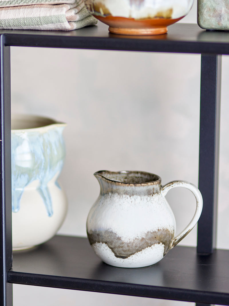 grey paula milk jug by bloomingville styled on black shelf with other ceramics
