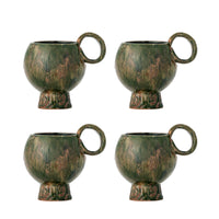Avonlea cups in green displayed with matching Nordic Simplicity ceramics
