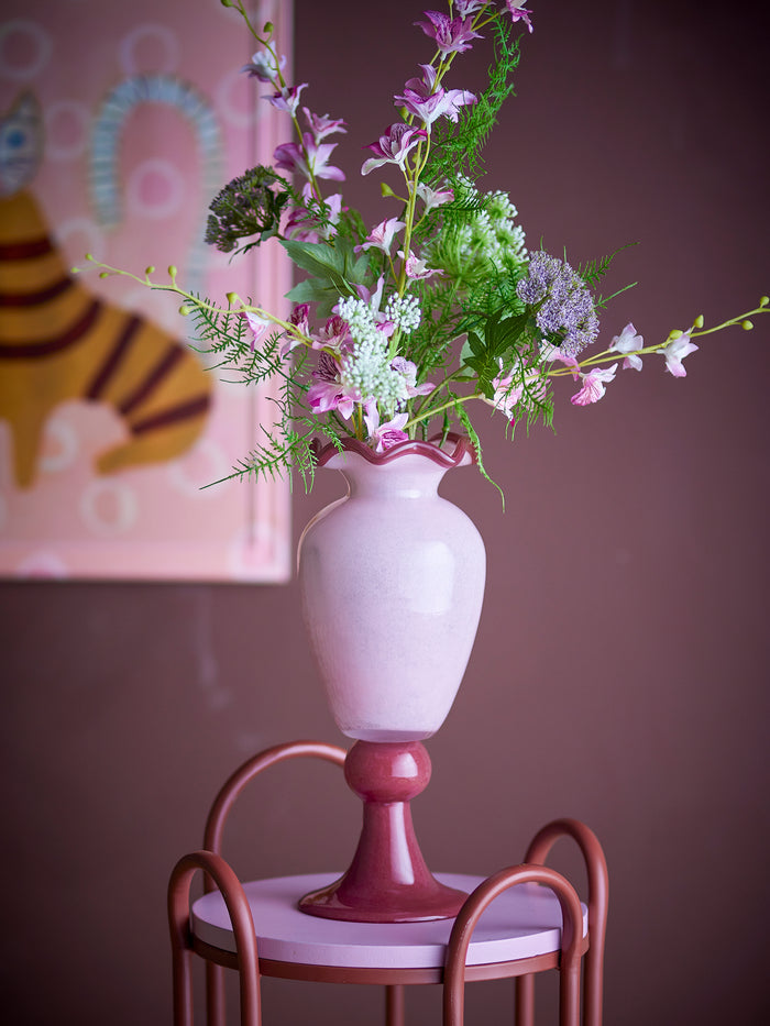 rose frills vase by bloomingville with tall bouquet against pink wall
