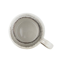 Top-down view of the Paula mug showing the grey rim, speckled cream glaze and pale interior