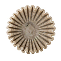 Top-down view of the Harmonia marble bowl with deep vertical ridges radiating from the centre