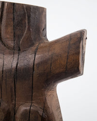 Close-up of the carved shoulder and outstretched arm of the House Doctor Human wood wall art, showing the dark espresso stain and natural mango wood grain