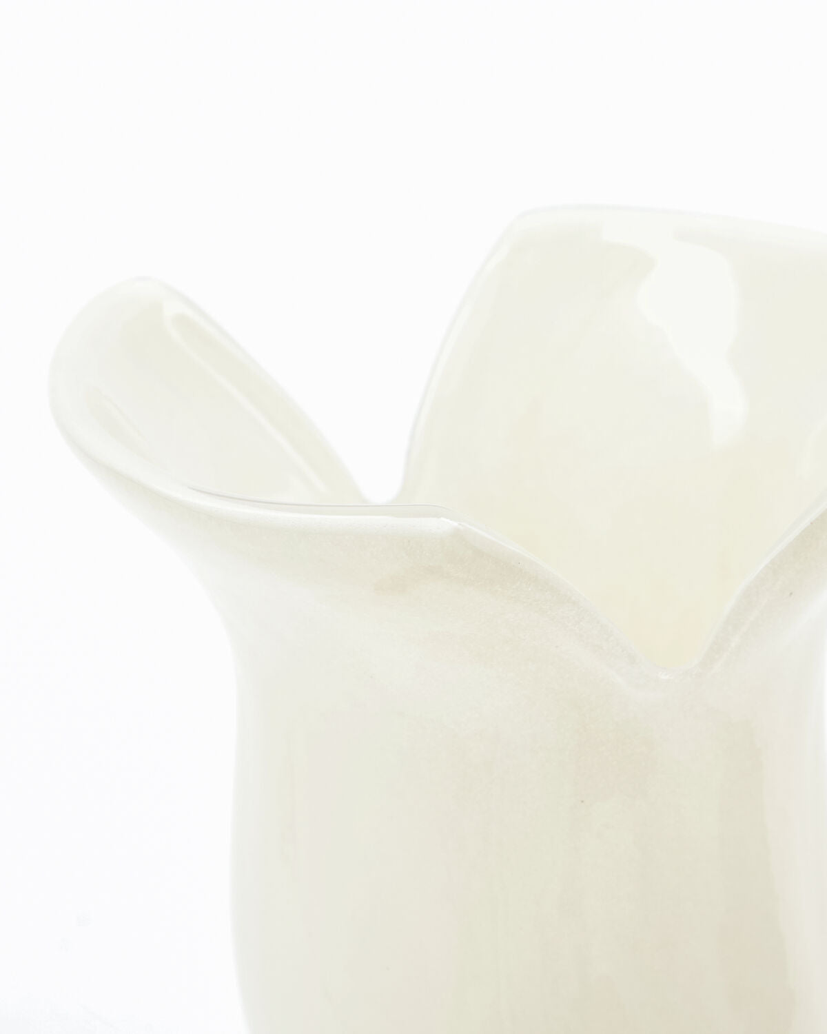 Close-up of House Doctor Cuff vase showing folded rim detail in off-white glass