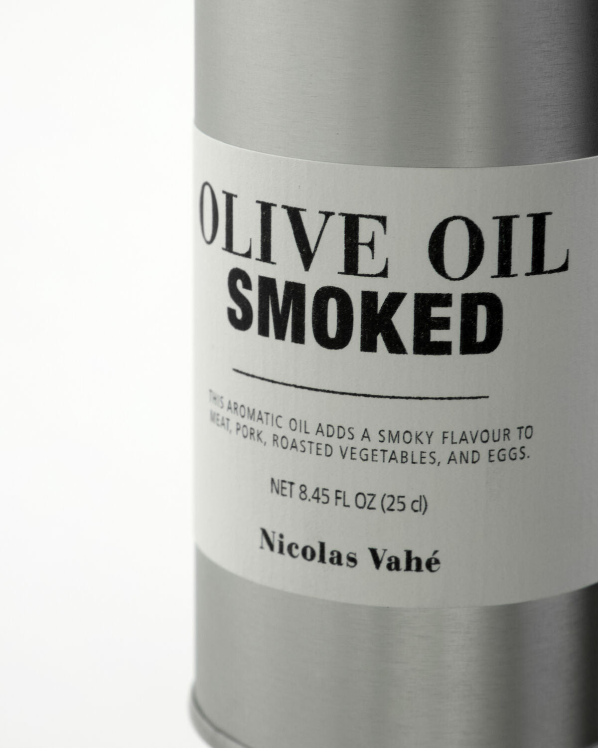 Close-up of Nicolas Vahé Smoked Olive Oil label on brushed aluminium tin