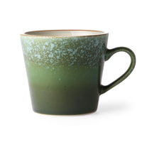 this aptly named 'grass' cappuccino mug is darker green at the bottom rising to a lighter, more dappled green at the top