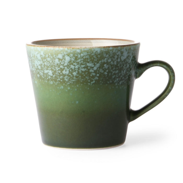 this aptly named 'grass' cappuccino mug is darker green at the bottom rising to a lighter, more dappled green at the top