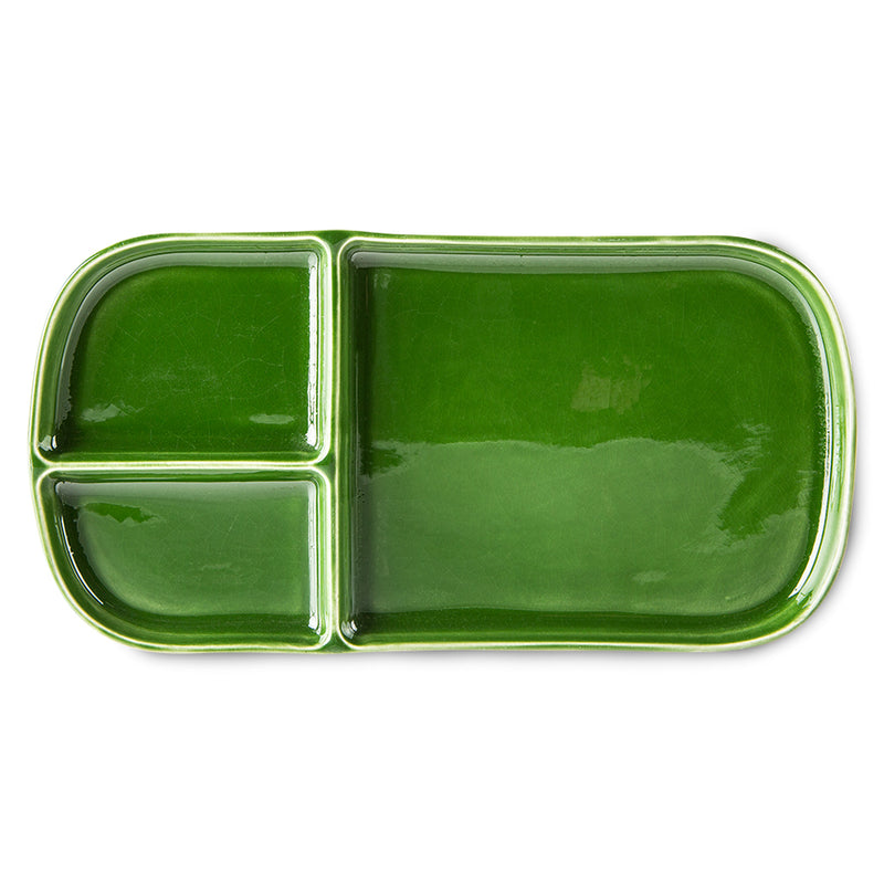 a shiney emerald green rectangular plate with 3 uneven sections perfect for seperating foods anad snacks from the dutch design house of hkliving