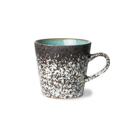 although called mug, this americano mug is a swirl of black and white with a flash of blue green for the inside