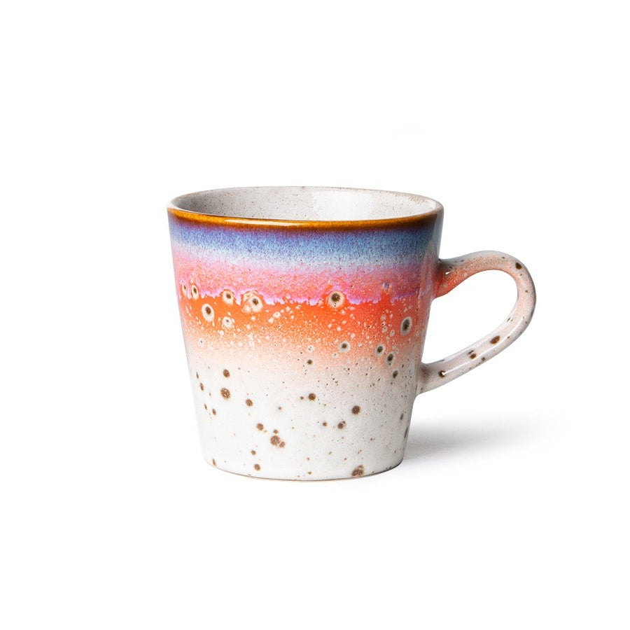 americano mug with red, blue, and a ight beige cream colour