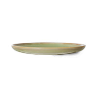 as each is hand painted, each plate is different which is even visible in this side on view of the green plate showing that even the underside is as cooourful as the top