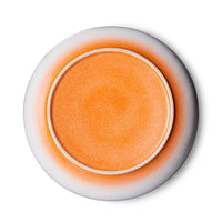 the bright orange underside of a hkliving serving bowl