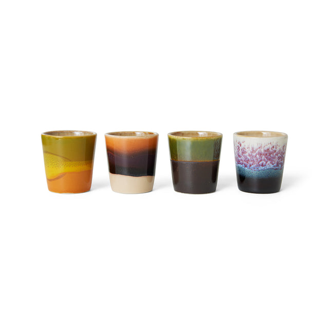 4 multicoloured hkliving egg cups in 70s styles looking like small shot cups