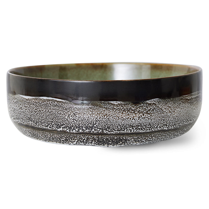 with a look of a sea shore as a crashed wave has receded leaving behind bubbles and foam all shown in black and white in this 70s ceramic bowl