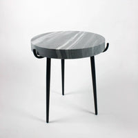 side view of the grey marble topped end table by nordic interiors olson and jensen showing off a more monochromatic style