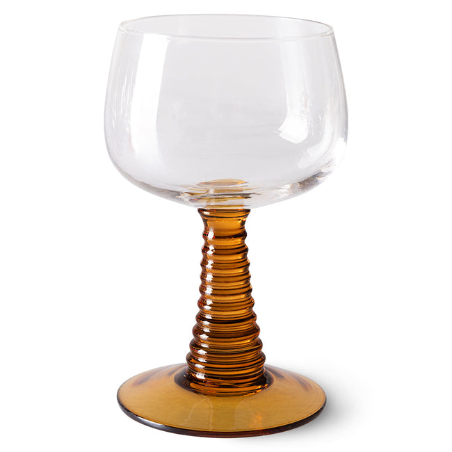 hkliving wine glass with a swrily cone shapoed stem and base in a burnt orange colour