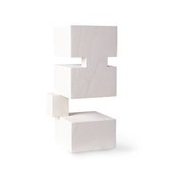 white at object of white wooden blocks somehow supporting each other despite being off-set against each other's position but harmoniously supporting the other above