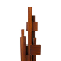 the top part of the medium hkliving teak wood sculpture showing that varied sizes of the pieces that make of the decorative piece