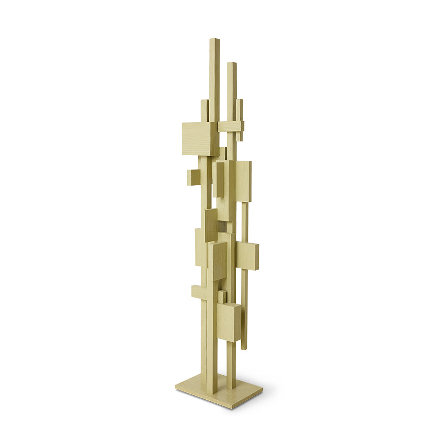 Angled view of the tall pistachio wooden Skyscraper sculpture on its square base
