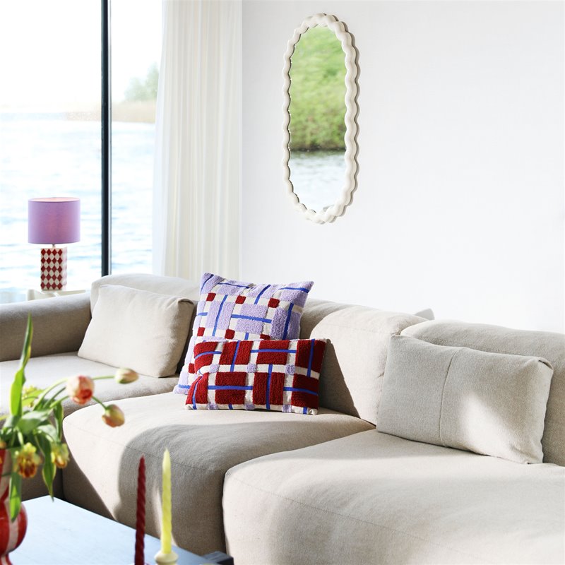 multicolour rectangular plano cushion by &k Amsterdam styled on a neutral sofa
