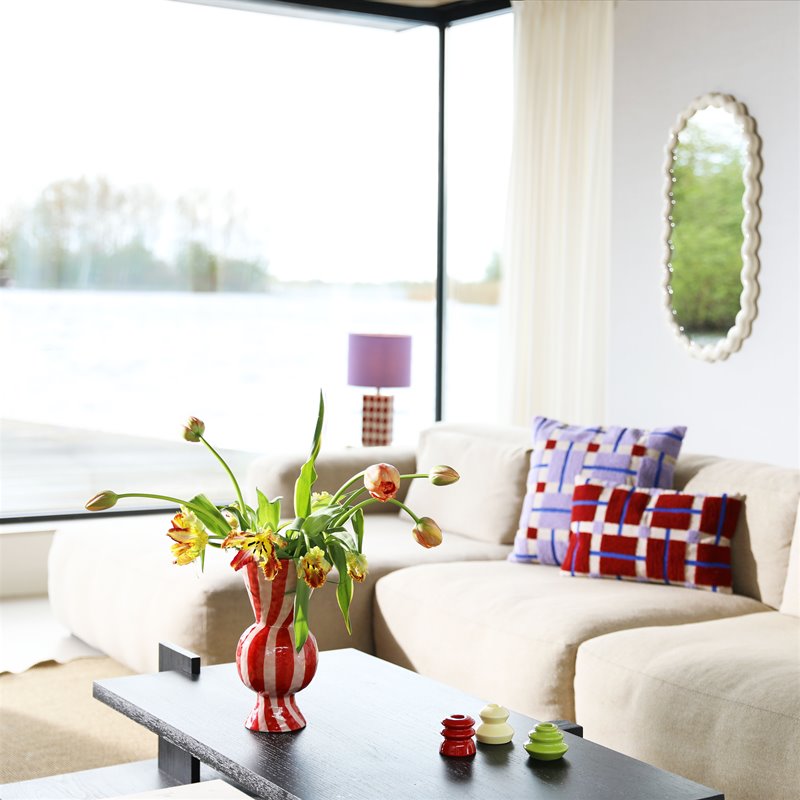 ed and cream geometric ceramic lamp with purple shade by &klevering styled in modern living room
