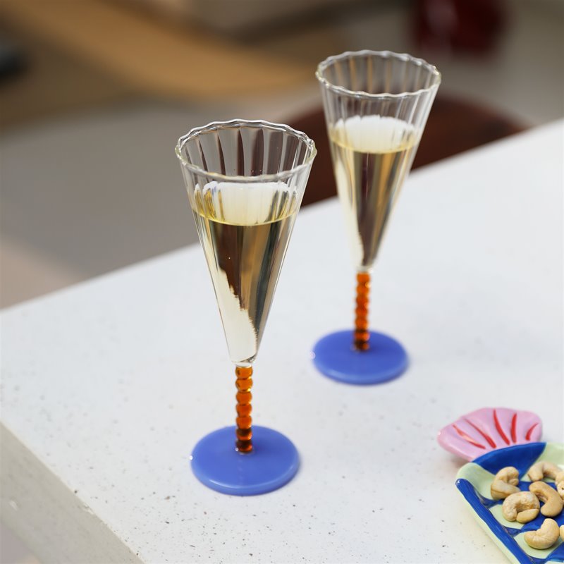 colourful candy-shaped ceramic plates styled on a table with snacks
