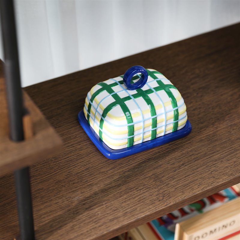 close-up of hand-painted plaid butter dish in blue tones
